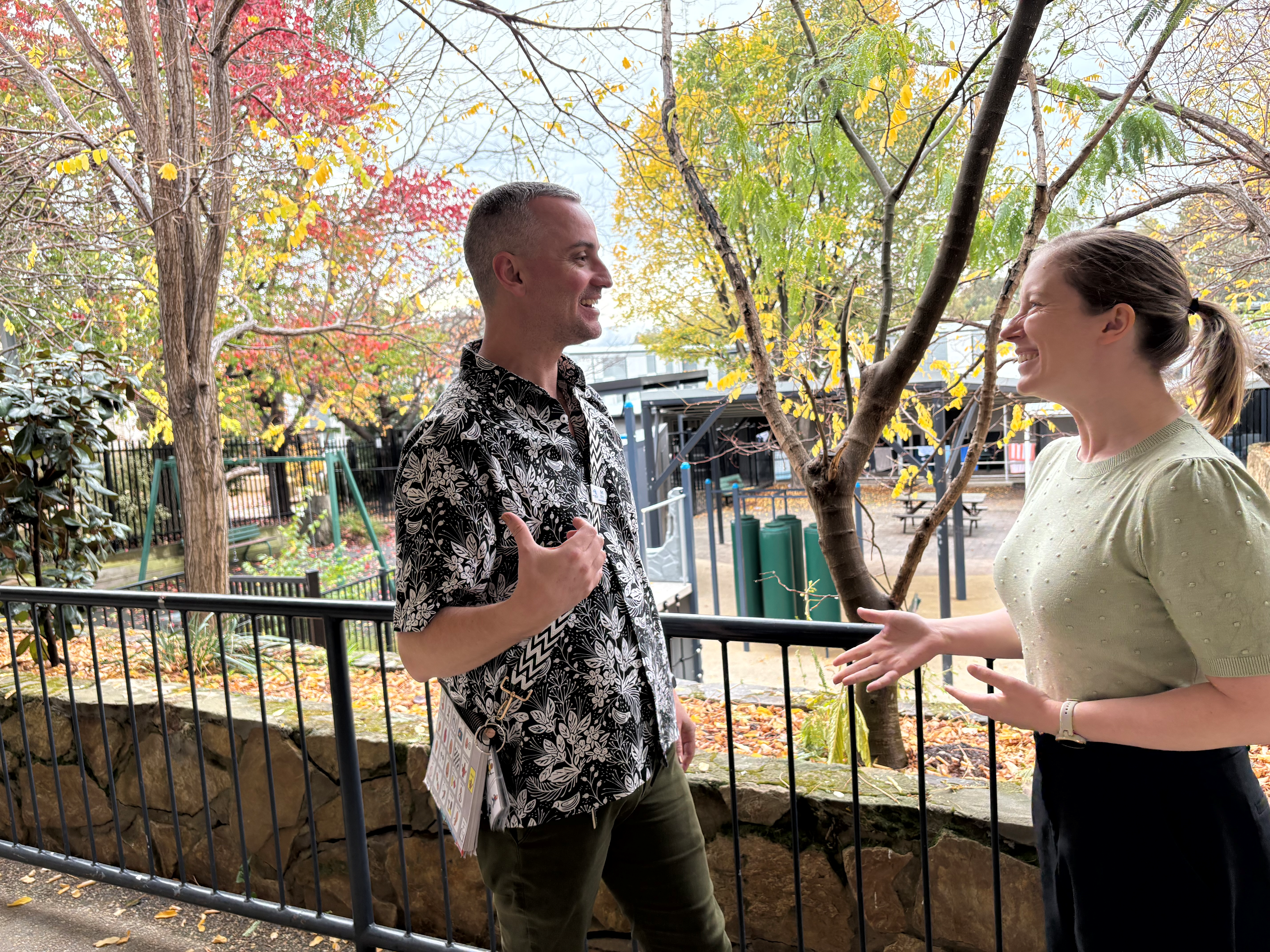 Dr Kayla Ball standing outside with a colleague