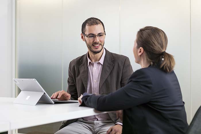 Two educators, engaged in conversation
