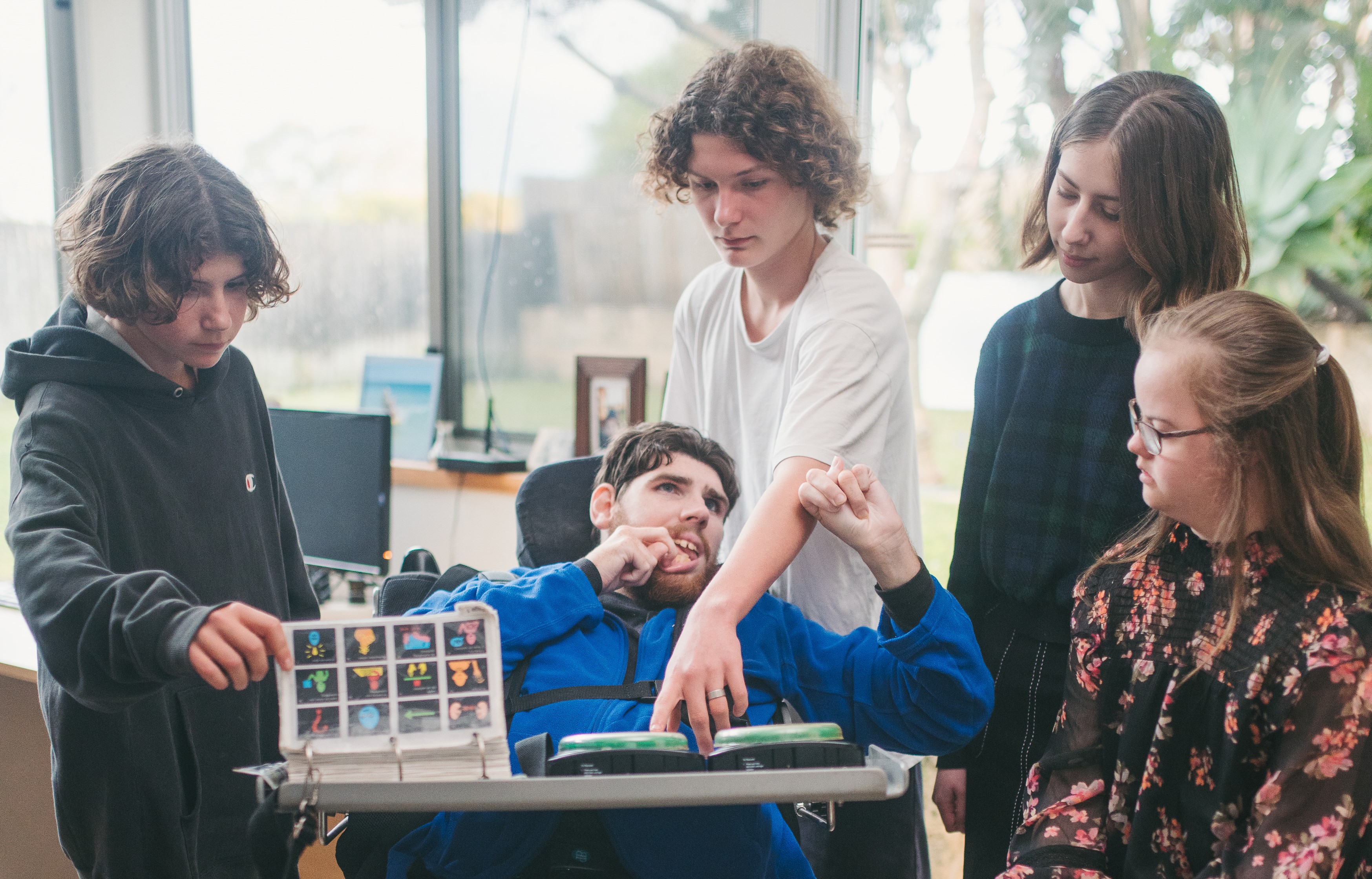 A group of people supporting an adult