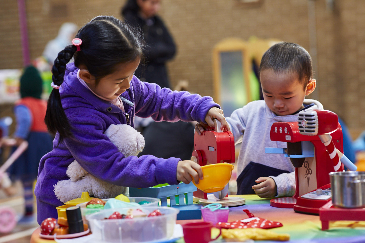 Young children playing with toys