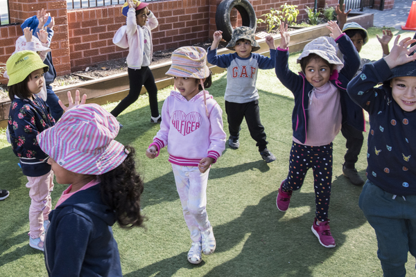 A group of children playing a game outside